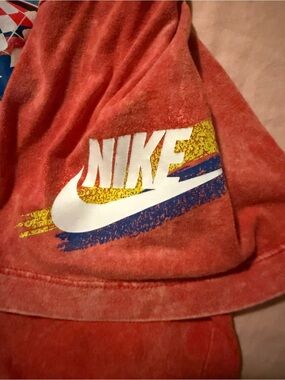 Nike Red Short Sleeve Tee with White Swoosh and Yellow/Blue Accent